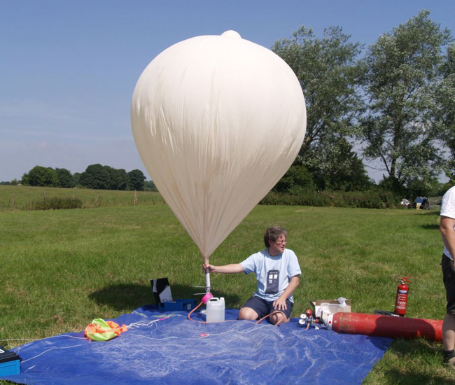 Dave Akerman inflates the balloon