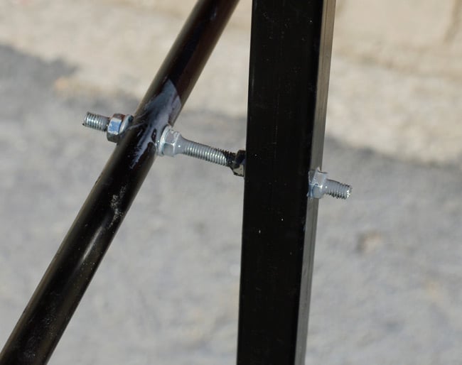 The lower end of the launch rod mount, bolted to the truss structure