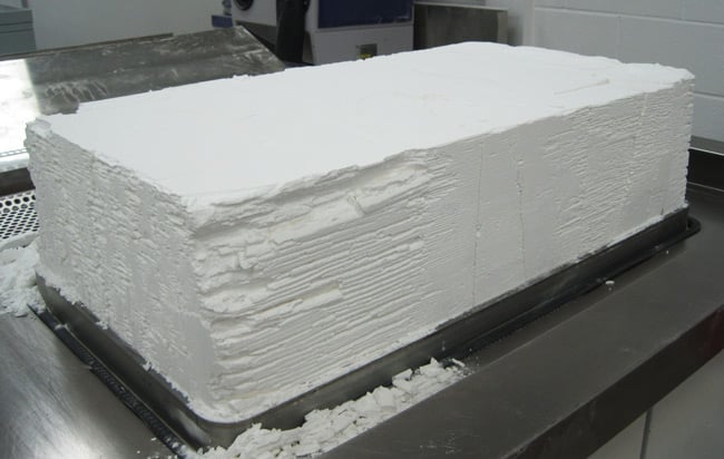 The block of nylon powder as it emerges from the 3D printing machine