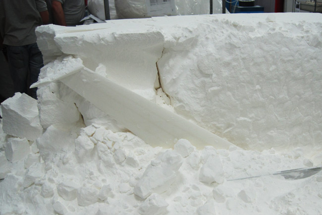 The wing begins to emerge from the nylon powder
