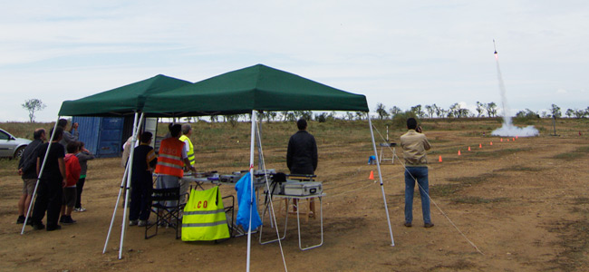 Another launch seen from behind the launch control tent