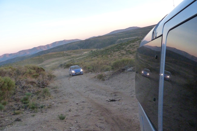 One of our pursuit cars seen from the other as we ascend a dirt track