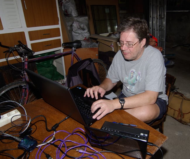 Dave Akerman at the computer inside the workshop