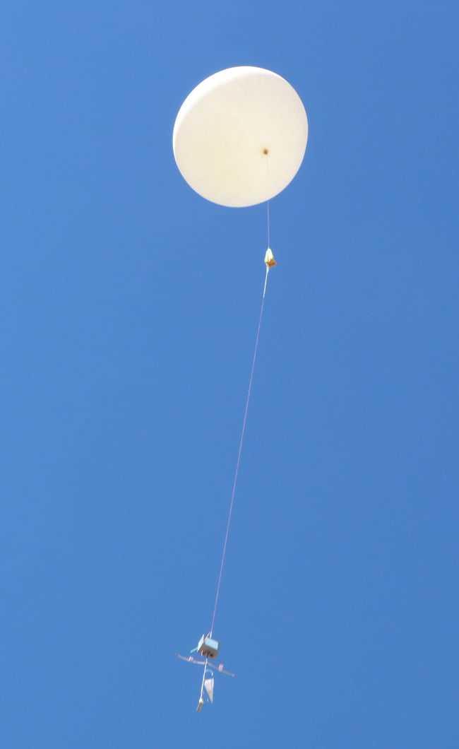 The balloon and payload in the air just after launch