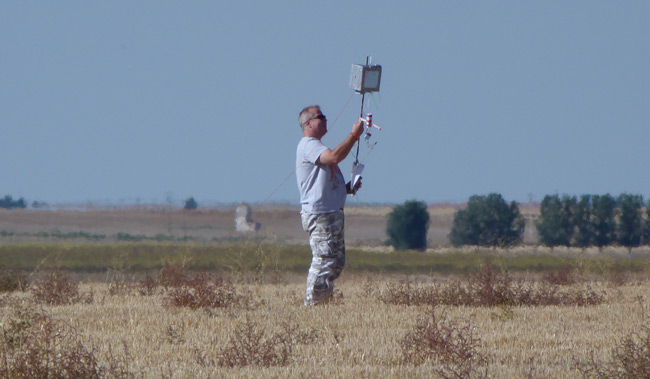 Paul with the payload in a big flat field of wheat stubble