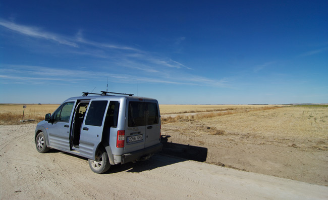 The pursuit van parked in the middle of a vast plain as we wait for the payload to land