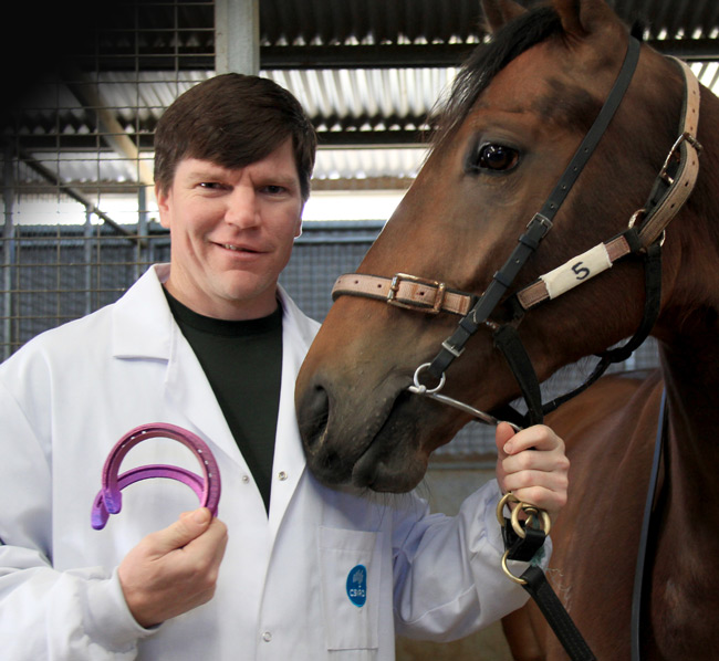 CSIRO researcher Chad Henry with the horseshoes and Titanium Prince. Pic: CSIRO
