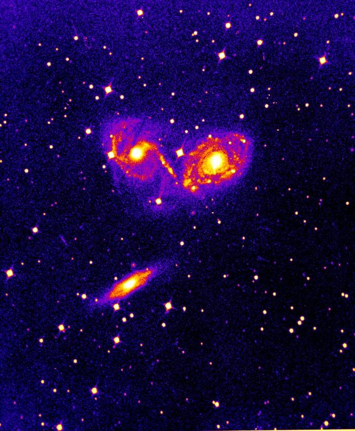 Photographic plate image of the colliding galaxies NGC 6769, 6770, and 6771.