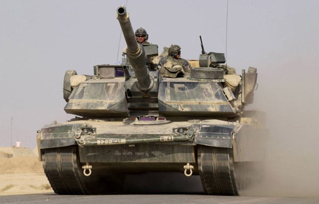 A US Army M1A1 Abrams tank heads out on a mission from Forward Operating Base MacKenzie in Iraq on October 27, 2004
