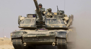 A US Army M1A1 Abrams tank heads out on a mission from Forward Operating Base MacKenzie in Iraq on October 27, 2004
