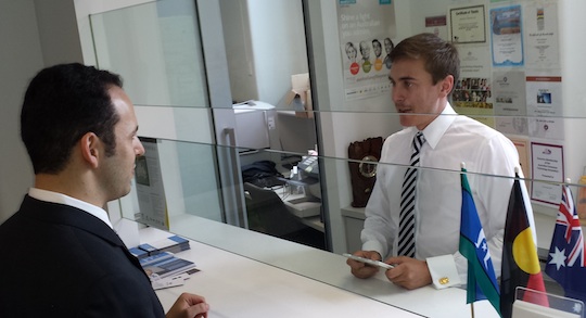 Vlad Lasky handing the 2700-strong change.org petition to a staffer in Malcolm Turnbull's office