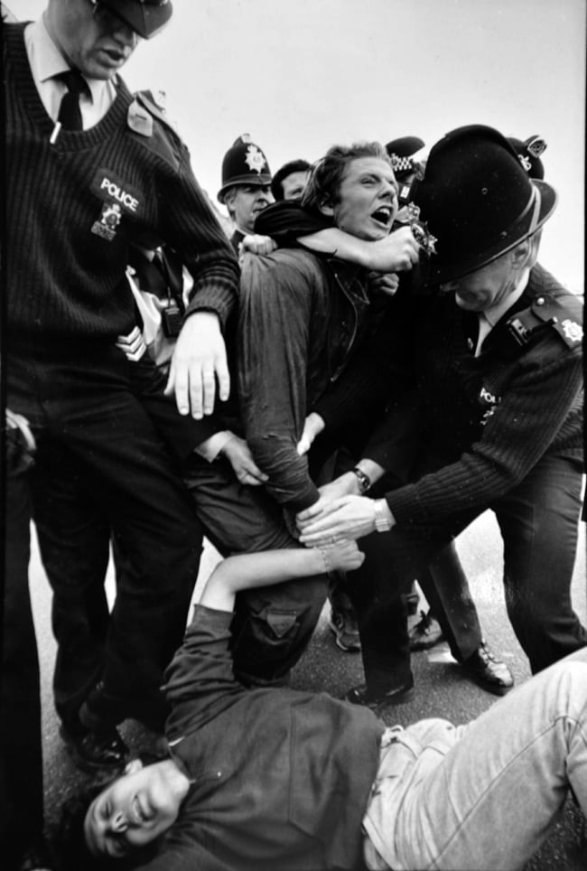 Black and white image by Phil of police battling protesters 