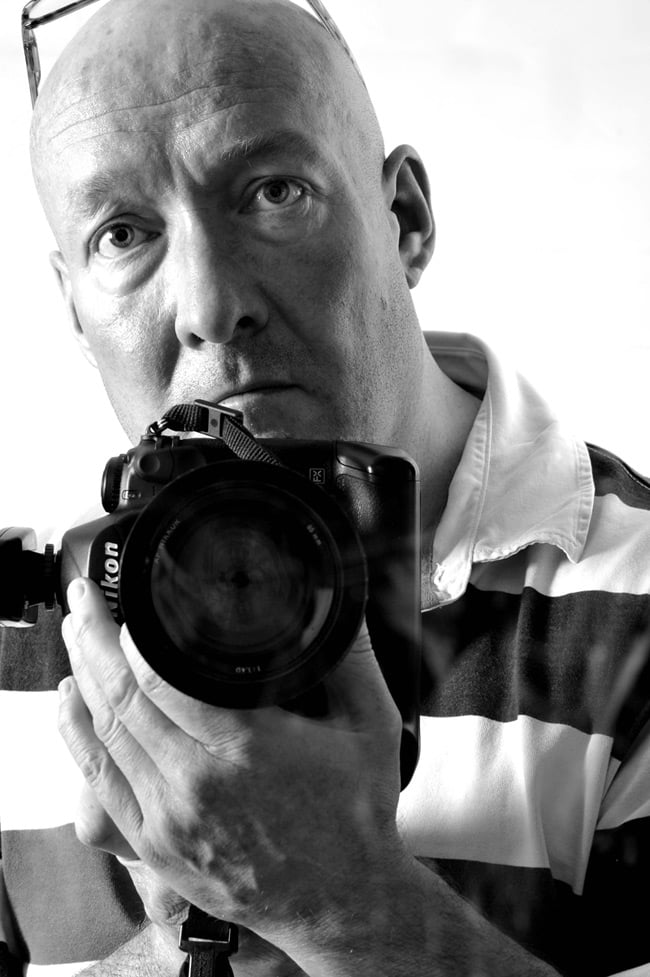 Portrait of Phil Houghton holding mighty Nikon