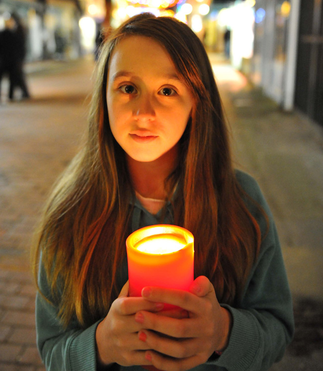 Portrait of Samantha with candle by Phil Houghton