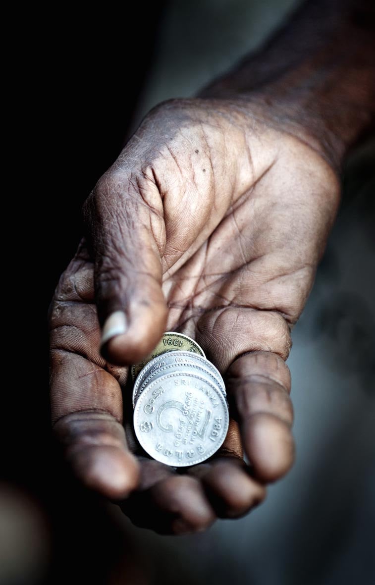 Photo of a hand with coins, taken in Sri Lanka by Phil Houghton