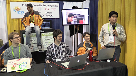 Team Boston posing on their conference stand