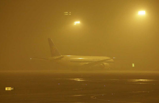 Airliner parked at Beijing Airport during the 'Airpocalypse' of January 2013