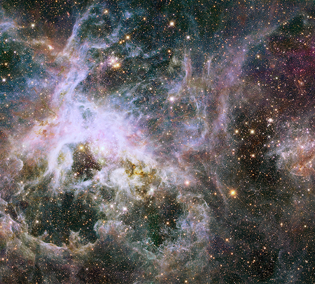 The Hubble mosaic, spanning a width of 600 light-years, of a star factory of more the 800,000 stars being born inside the Tarantula Nebula.