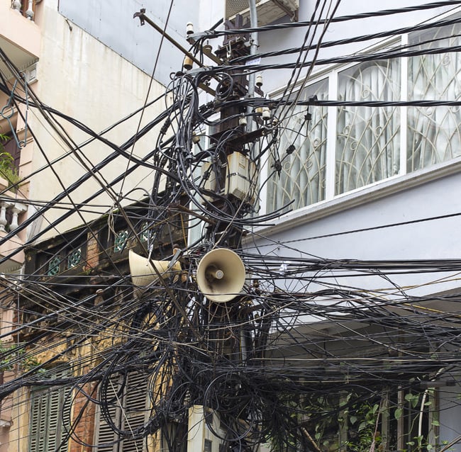 Tangle of cables attached to a telegraph pole