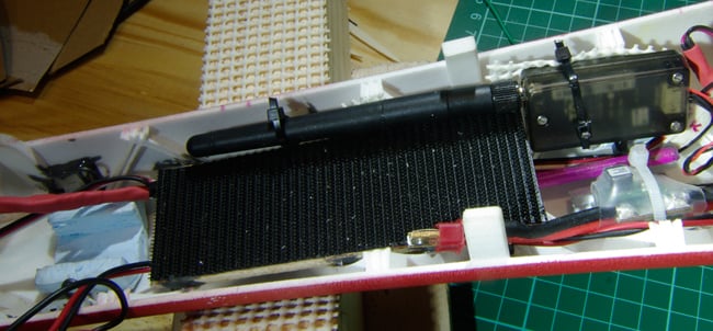 The wooden battery platform with Velcro, running down the fuselage