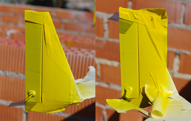The rudder partially masked and painted yellow