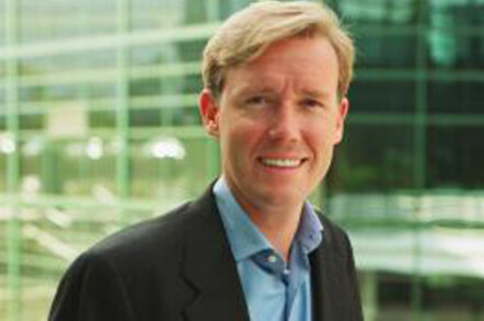 head and body picture of Michael Robertson, wearing navy jacket and blue shirt