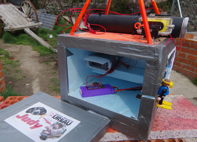 The Judy mission payload box, with rocket motor case, motor heater rig, and camera