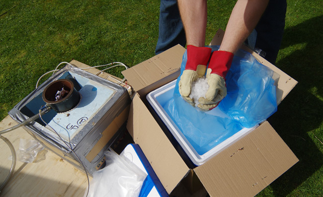 Dry ice being loaded into the REHAB chamber