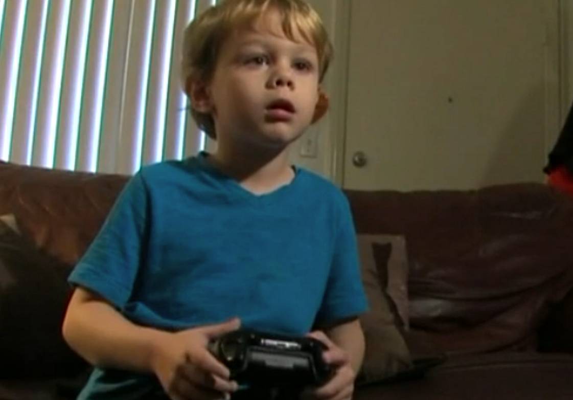 Still of Kristoffer playing on the Xbox