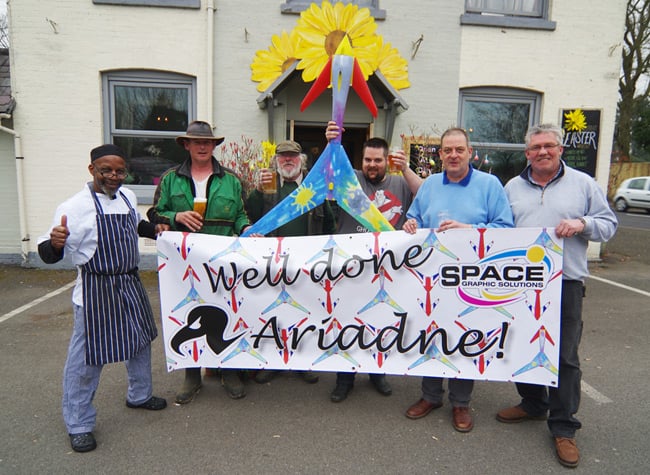 The Space Graphics Solutions team poses with the wrapped Vulture 2