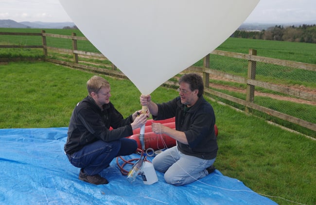 Anthony and Dave fill a balloon yesterday