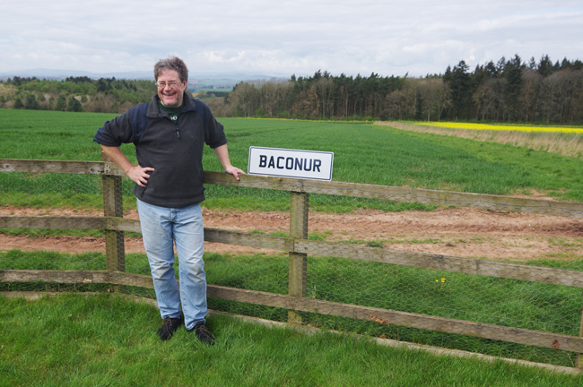 Dave Akerman poses with a Baconur sign