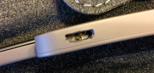 Photo of a demo Google Glass headset with a destroyed USB port