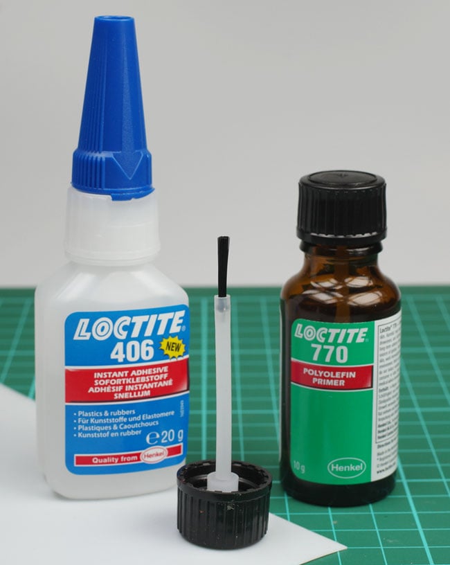 Bottles of Loctite 770 and 406, plus a sheet of Teflon