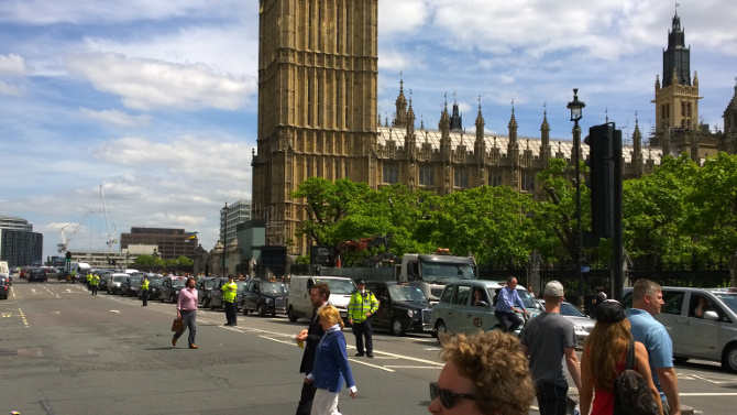 Black cabs inch over Westminster Bridge in protest against Uber