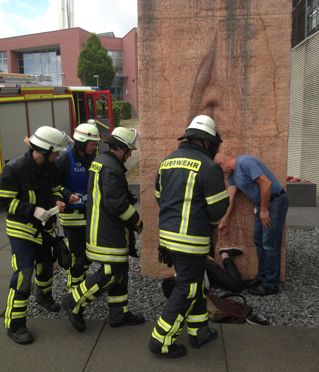 Firefighters attend the man trapped inside the giant vagina