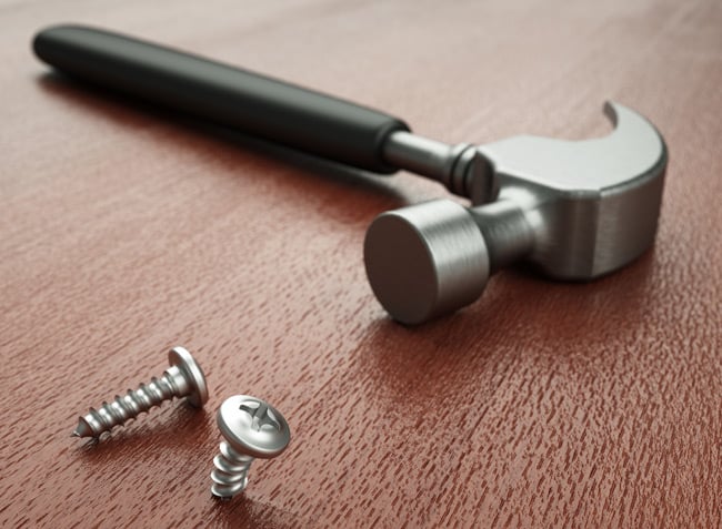 A hammer and bent screw