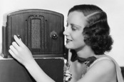 Old-timey 1940s woman tunes AM radio