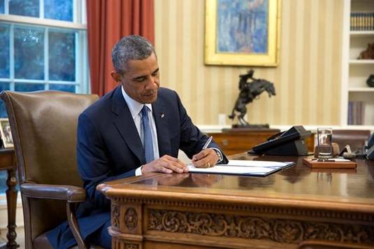 President Obama signs the Unlocking Consumer Choice and Wireless Competition Act