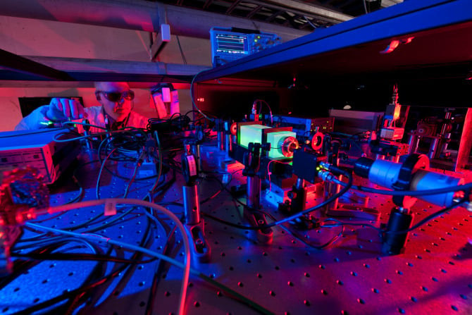 A Fermilab scientist works on the laser beams at the heart of the Holometer experiment