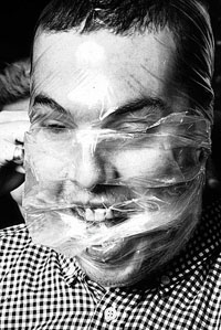 Alexander McQueen face wrapped in plastic © Stephen Callaghan/Rex USA