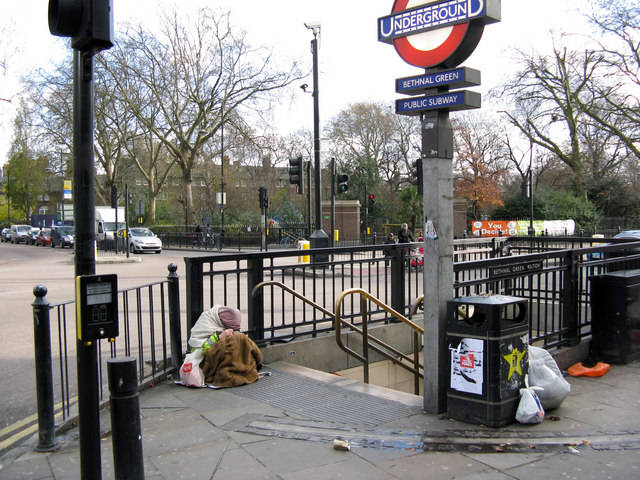 Entrance to Bethnal Green Underground station A homeless person sits at the top of the steps, too dispirited even to beg