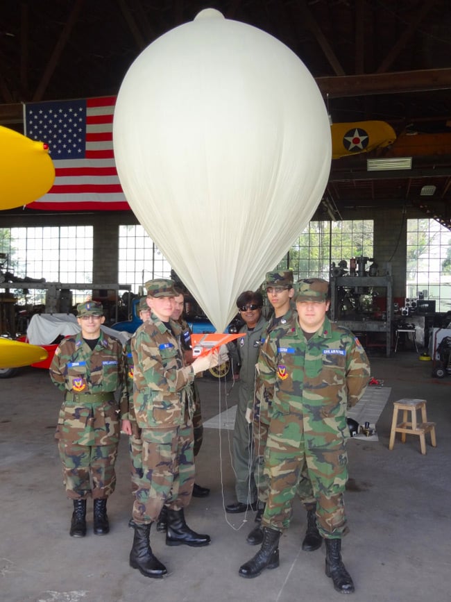 Fox Valley Composite Squadron cadets and officers with the balloon and paper plane