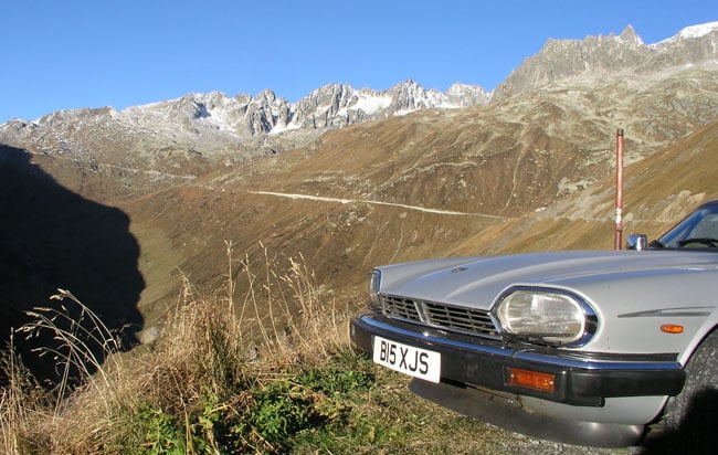 Fuel efficient Jaguar XJ-S on the Furka Pass in the Swiss Alps