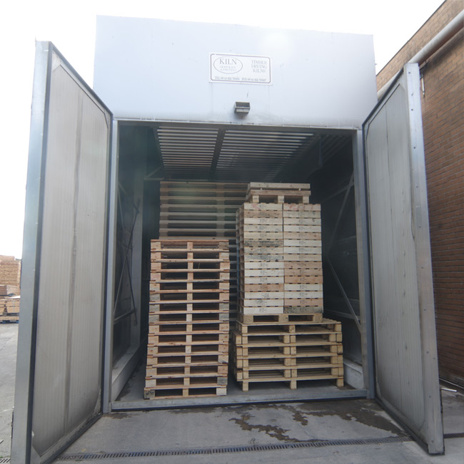 The treatment kiln filled with pallets