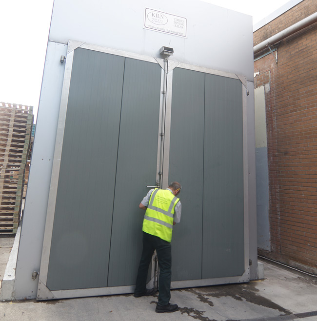 The doors closing on the treatment kiln