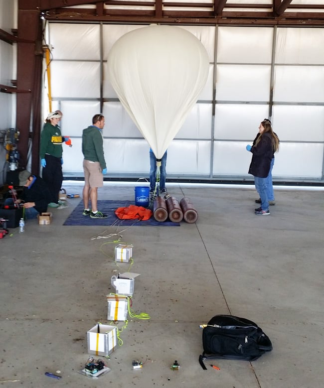 The Edge team inflates the balloon