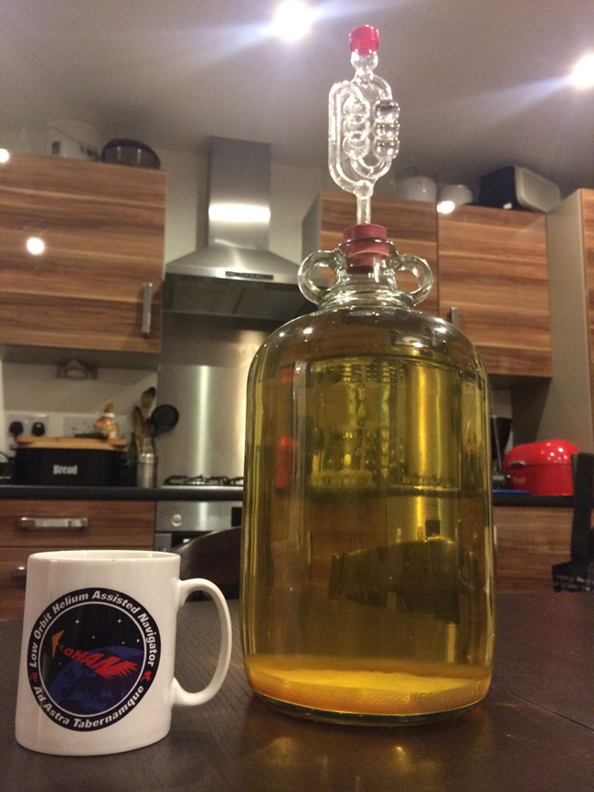 A LOHAN mug stands next to Mike Kimber's demijohn of mead