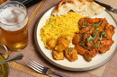 Chicken Jalfrezi and rice with a beer. Pic by Shutterstock