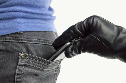 Gloved hand reaches into victim's pocket to steal mobile phone